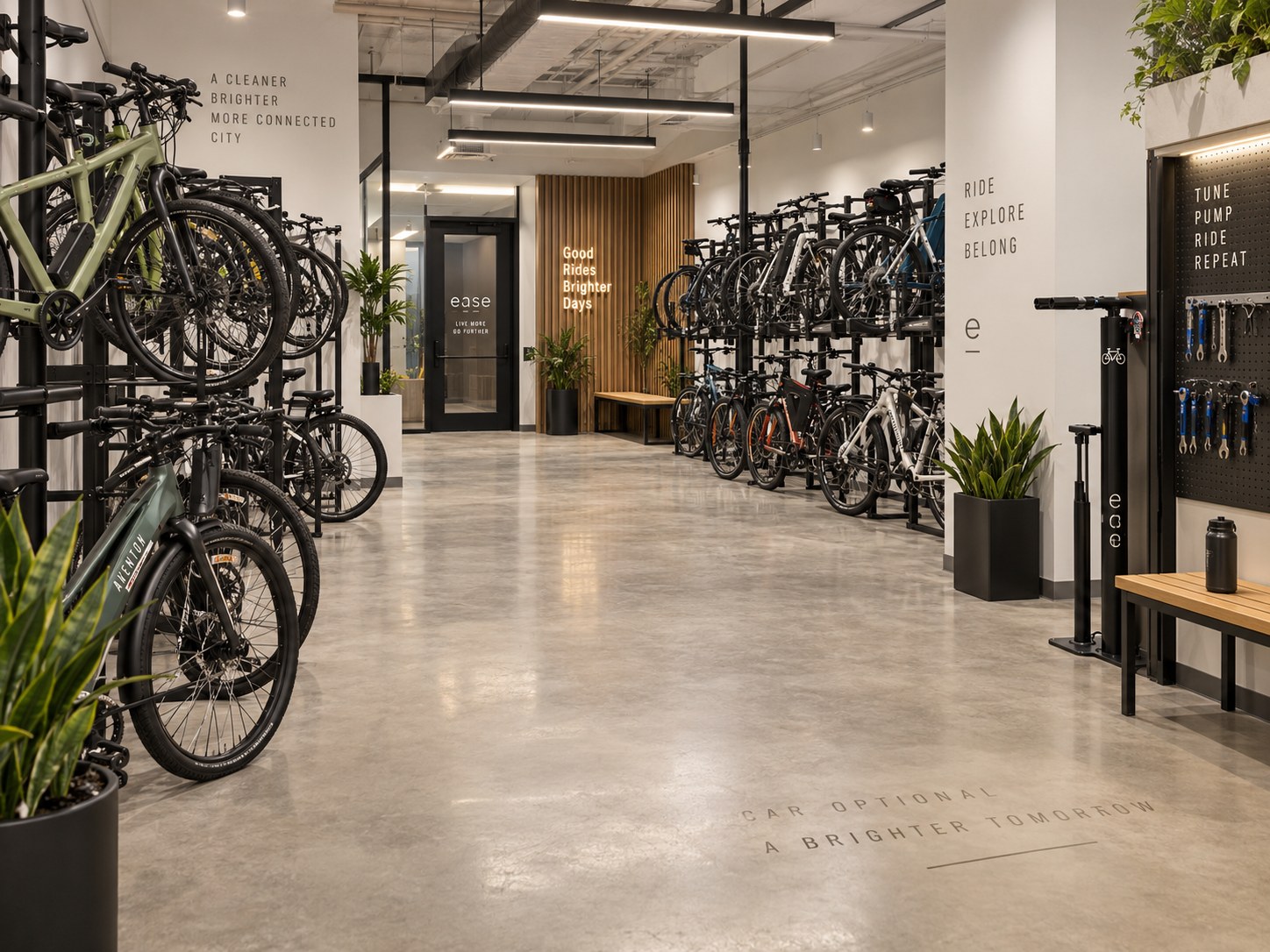 Indoor bike storage room with racks of bikes and e-bikes, a tune-up station, and tools